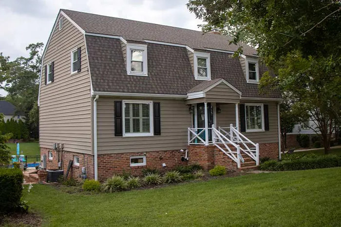 Gambrel roof shingle project completed by Virginia roofers